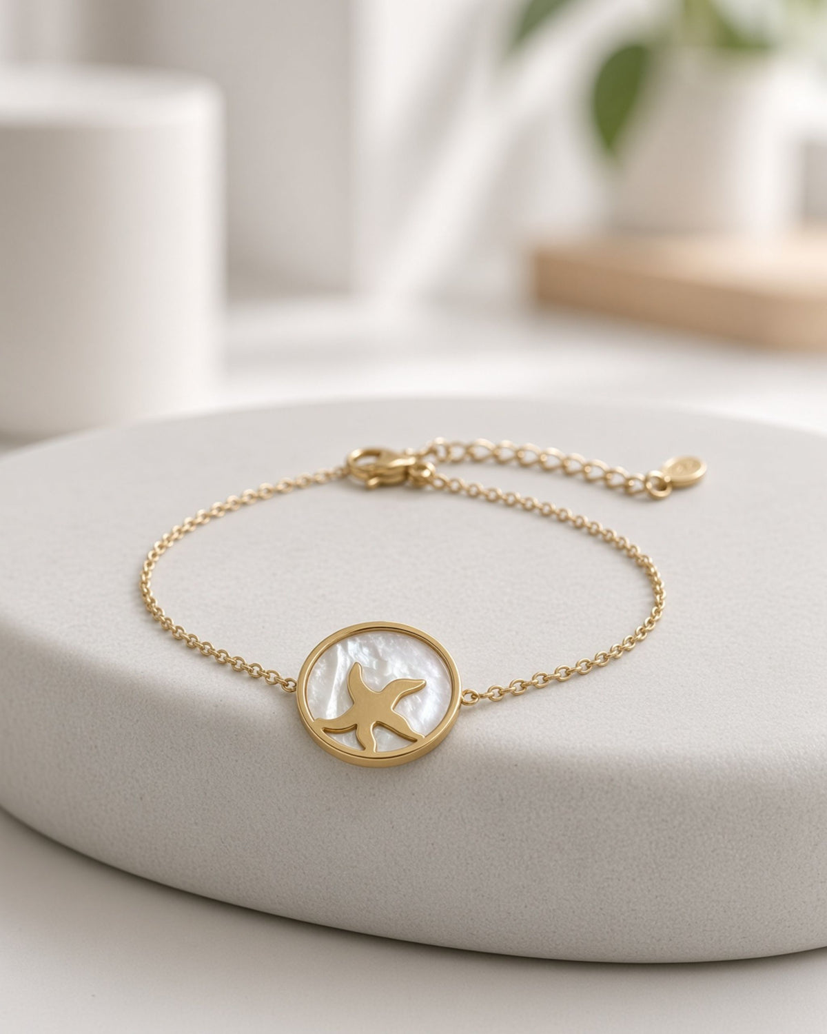 Golden starfish in seahsell bracelet