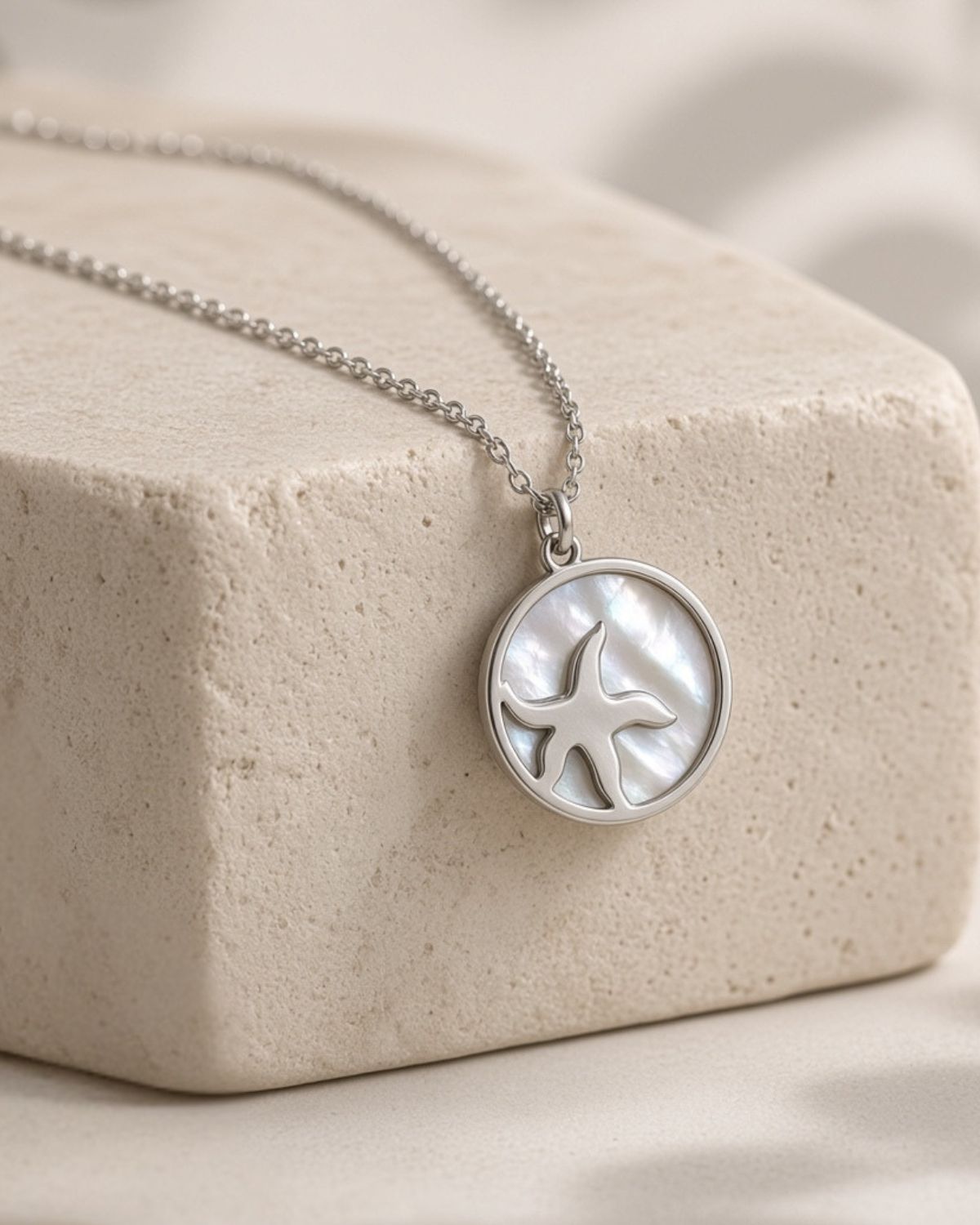 Silver necklace with starfish in seashell