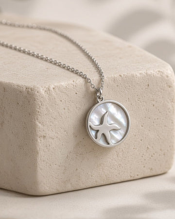 Silver necklace with starfish in seashell